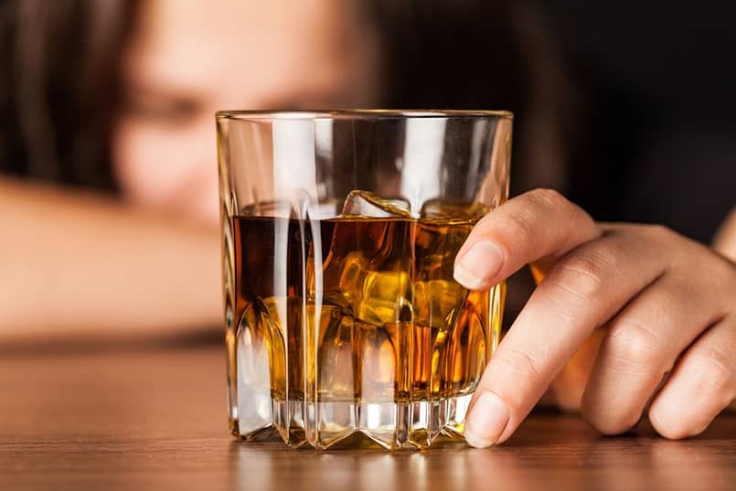 woman holding a drink